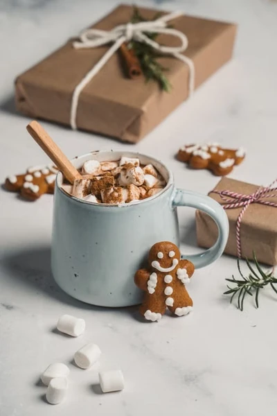 pale blue handmade ceramic mug with gingerbread cookies