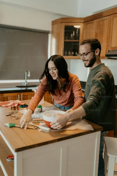 Couple baking together at a kitchen counter